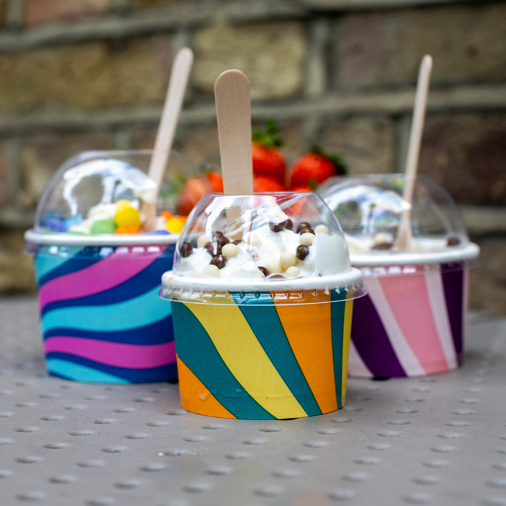 Packaging Wise 4oz clear RPET dome lid — transparent, secure closure for colourful ice cream tubs, ideal for premium product visibility in takeaway service.