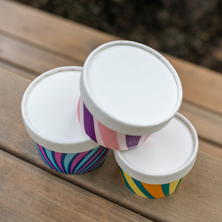 Packaging Wise 6oz white paper lid — snug-fit closure for colourful ice cream tubs, ideal for secure takeaway presentation and professional shelf display.
