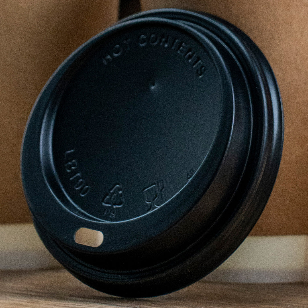 Black plastic sip-through hot cup lid – top view